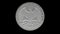 A quarter-dollar coin quarter rotates around its axis, alpha channel, looped video.