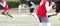 Quarterback about to pass to receiver in a 7 on 7 football game with a blurred background