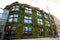Quay Branly museum - green building with a large green wall. It located just a stone throw from the Eiffel tower. Paris