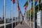 Quay pavement with rows of various national flags at Rotterdam Netherlands