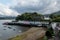 The Quay Street in Portree, Scotland, UK with typical SCottish houses and a small port