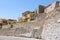 Quay wall and above it the colored houses next to the Firka Venetian Fortress in the Old Venetian Port of Chania, Crete, Greece