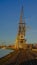 Quays of the harbor of Antwerp, with old industrial cranes in warm sunset light