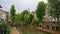 Quays of `oudegracht` canal in Utrecht, with typical dutch houses, with cellars coming out on an old wharf