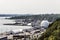 Quebec City Canada overlooking Saint Lawrence river and rafinery industry with industrial harbor and bridge background