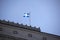 The Quebec flag flies over an old office building in Montreal