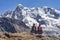 Quechua girls admire Andean mountain views on the Ausangate trail. Cusco, Peru