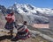 Quechua girls admire Andean mountain views on the Ausangate trail. Cusco, Peru