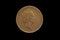 Queen Elizabeth II on obverse of the Great Britain one penny coin of 1996, isolated on a black background