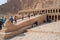 Queen Hatshepsut mortuary temple and the red cliffs of the western bank of the Nile river