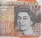 Queen head on money cash ten pounds note