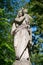 Queen of Heaven. Ancient statue of the Virgin Mary with Jesus Christ. Fragment of an ancient statue. Vertical image