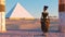 Queen Nefertiti admires the pyramids and desert views from the ancient temple. Historical animation. The Great Pyramids