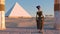 Queen Nefertiti admires the pyramids and desert views from the ancient temple. Historical animation. The Great Pyramids In Giza