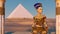 Queen Nefertiti in front of the great pyramid of Giza and a view of the desert in the ancient temple. Historical