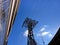 Queensboro Bridge cableway in New York City during winter daytime against a blue sky