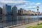 Queensbridge Park with a Street Light along the East River with the Roosevelt Island Skyline in New York City