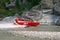 Queenstown, New Zealand - February 9, 2007: The world famous Shotover Jet boat thrills tourists down the Shotover river, South Isl