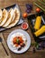 Quesadilla, salad with cottage cheese and tomatoes, two corn on wood table.