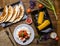 Quesadilla, salad with cottage cheese and tomatoes, two corn on wood table.