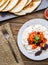 Quesadilla, salad with cottage cheese and tomatoes on wood table.