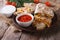 Quesadilla slices on a plate and sauces closeup. horizontal