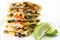 Quesadillas stacked with lime