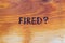 Question fired handwritten with hand woodburner on flat brown wood surface