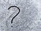 Question mark handwriting on snow close-up. Difficult situation concept. Confusion concept