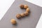 a question mark made of walnuts. The concept of frequently asked questions