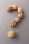 a question mark made of walnuts. The concept of frequently asked questions