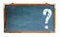 Question mark white sign with negative space for text on a blue old grungy vintage wide wooden chalkboard or retro blackboard