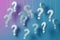 Question marks hanging on gradient background seeking answers concept