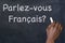 Question `Parlez-vous Francais?` on a blackboard