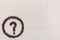 Question symbol in circle from coffee beans on linen texture, aligned bottom left