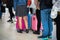 Queue of Asian people waiting at boarding gate at airport. Closeup.