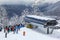 The queue for boarding the ski lift at the Rosa Khutor resort on a sunny day