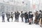 Queue at a bus stop under unexpected snow