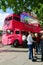 Queue in front of an old double decker bus