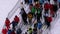 The Queue on the Ski Lift. Crowd of Skiers Stands and Crowds at Turnstile Gates