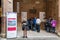 Queue to purchase a ticket at the ticket office to visit the Palazzo Pubblico in Siena, Italy