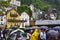 Queue of tourists on a ferry on a rainy day in Hallstatt