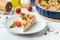 Quiche with chicken decorated with tomatoes, basil and broccoli