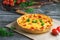 Quiche lauren - cheese vegetable pie with chicken on a wooden table