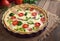 Quiche lorraine tart pie with broccoli, bacon, cheese and tomatoes