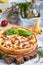 Quiche open tart pie with chicken meat, forest mushrooms, onion and cheese