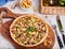 Quiche â€“ open tart pie with chicken meat, chanterelles mushrooms, onion and cheese.