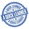 A QUICK LEARNER text on blue round stamp sign