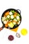 Quickly frozen vegetable mix in frying pan on white background