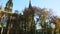 Quickly panorama from autumn park to old catholic cathedral church in Lviv, Ukraine